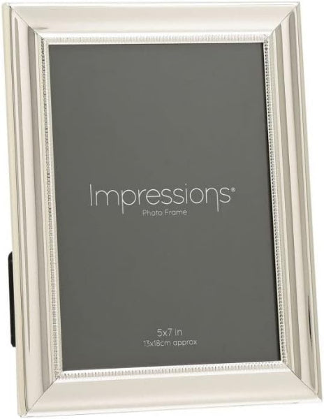 Silver photo frame with 'Impressions' branding on a gray background