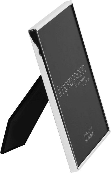 A slim black picture frame with a reflective silver metallic border and a matching black easel stand, shown on a plain white background. The frame has 'Impressions by Design' printed on the inside.