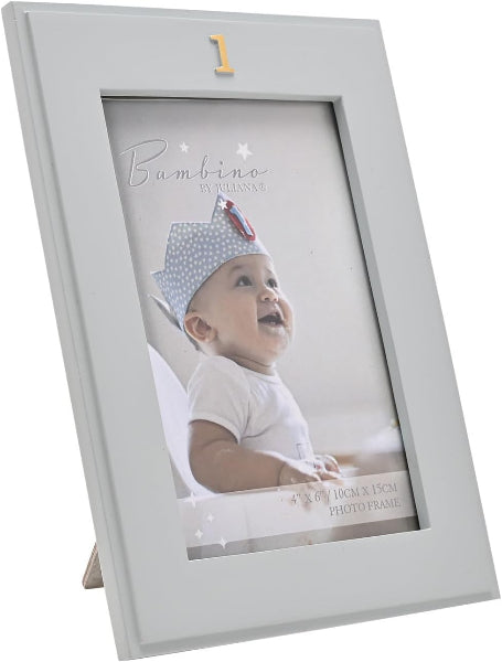 A light gray wooden picture frame with a small gold number 1 at the top, shown standing on its back. The frame contains a sample photo of a baby wearing a polka-dot hat.