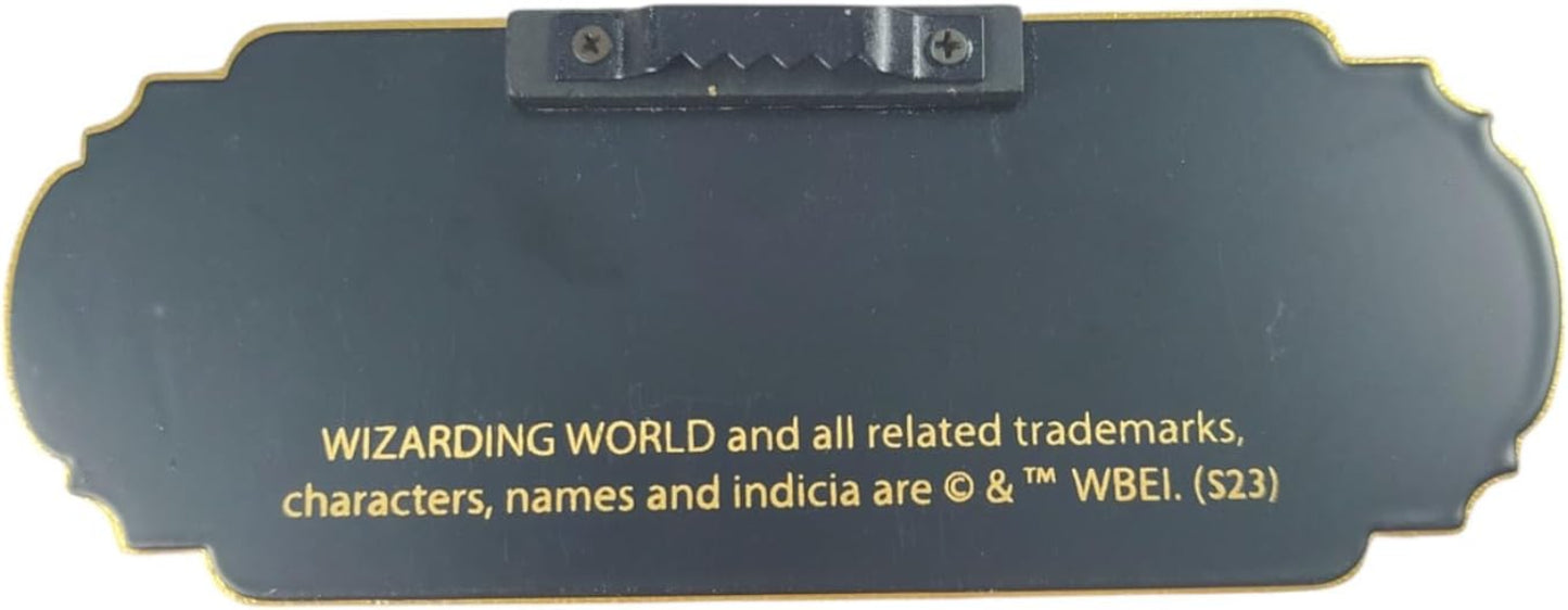 Metallic badge with 'Wizarding World' branding and copyright notice.