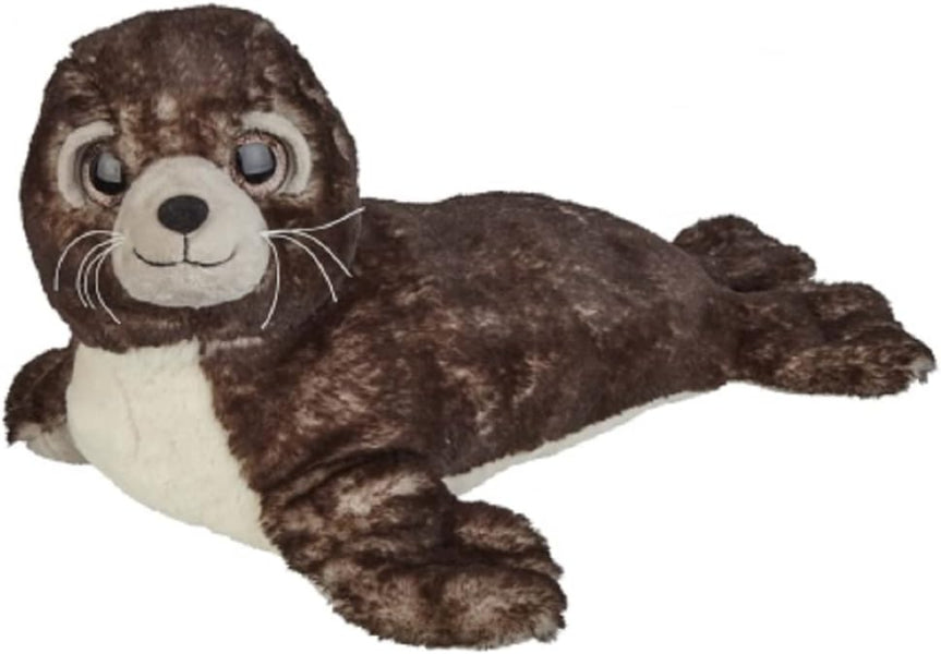 A plush toy seal lying down, featuring dark brown and black mottled fur, a cream-colored chest and muzzle, and large glossy eyes, isolated on a white background.