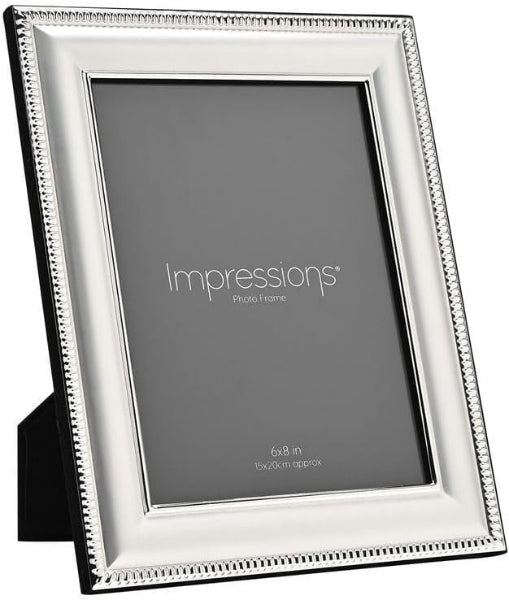 A silver picture frame with a decorative beaded border and a black backing, shown on a white background. The insert card reads 'Impressions photo frame' and '6x4 in tableau approx'.