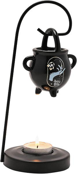 Black ceramic oil burner with a skull design on a white background