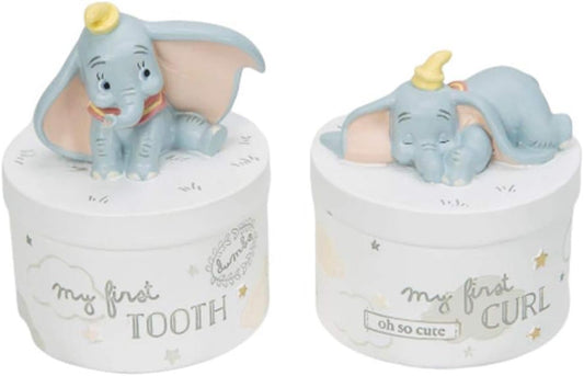 Two small containers with elephant figurines on top, labeled 'my first tooth' and 'oh so cute'.