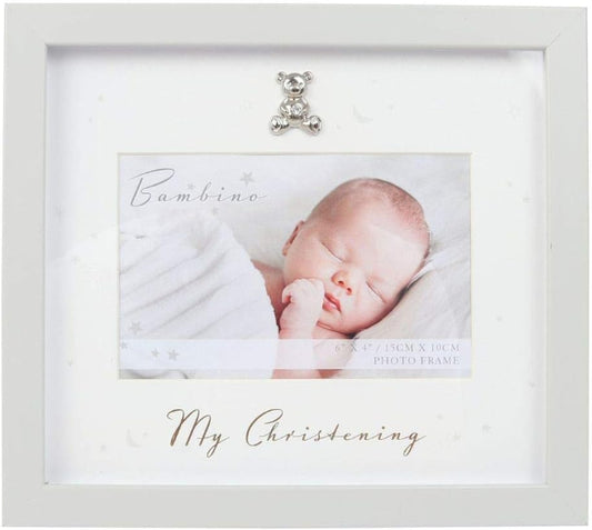 White photo frame with a baby photo and decorative bear charm on a white background