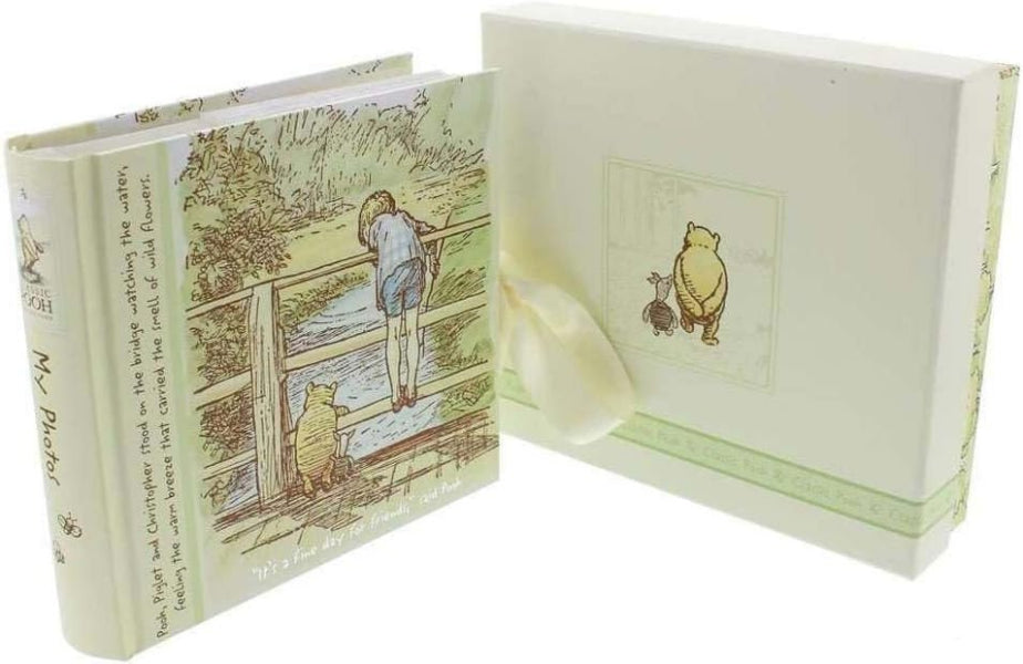 Illustrated book with characters on a wooden bridge, featuring a ribbon marker.