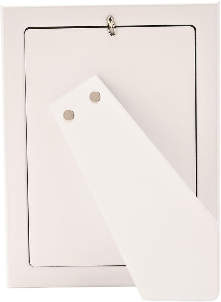 White card with a gold ring and triangle-shaped object on a light pink background
