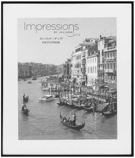 Framed photo of a canal scene with buildings and boats, branded 'Impressions by Juliana'.