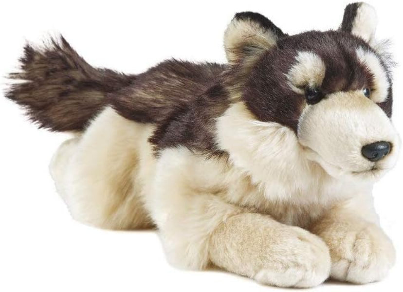 Plush toy husky lying on a white background