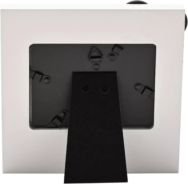 A close-up of the back of a square white picture frame or frame mount, showing a black mounting plate and a black support arm extending downward.