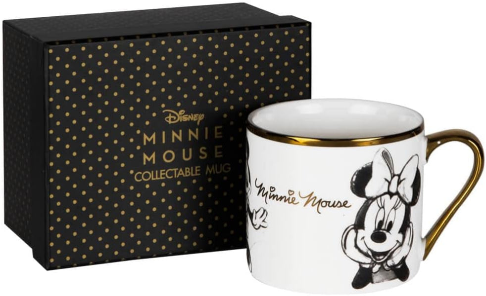 Disney Minnie Mouse collectable mug in white with gold trim and a gold handle, shown next to its black gift box with gold polka dots and gold lettering.
