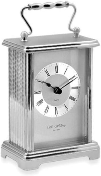 Silver carriage clock with white face on a white background