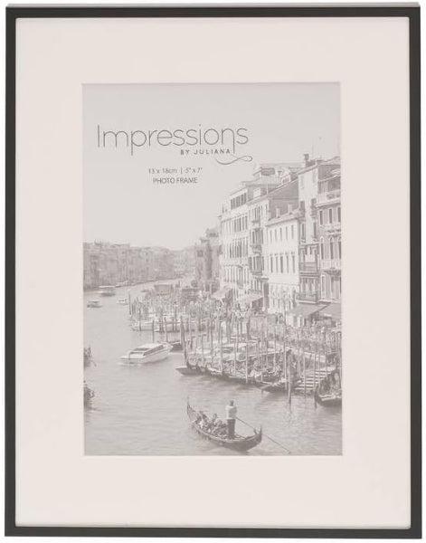 Framed photo print of a cityscape with boats on a canal, labeled 'Impressions by Juliana'.