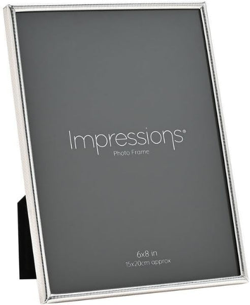 Silver photo frame with 'Impressions' branding on a white background
