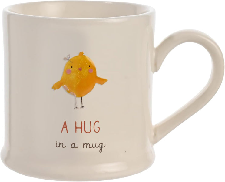 Mug with a chick illustration and 'A Hug in a Mug' text on a white background