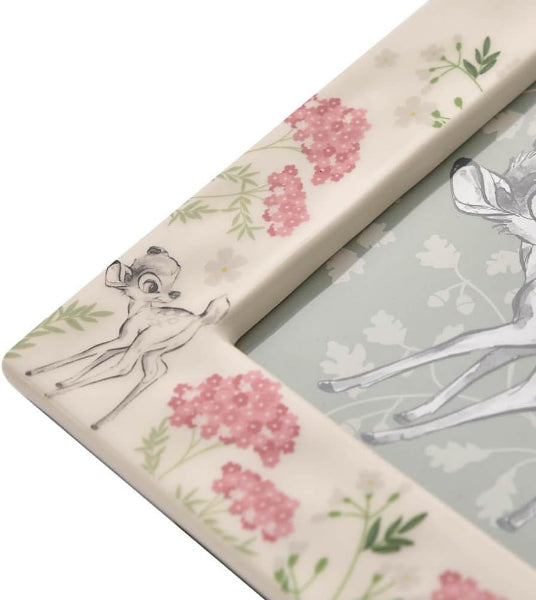 Decorative picture frame with floral and fairy design on a white background