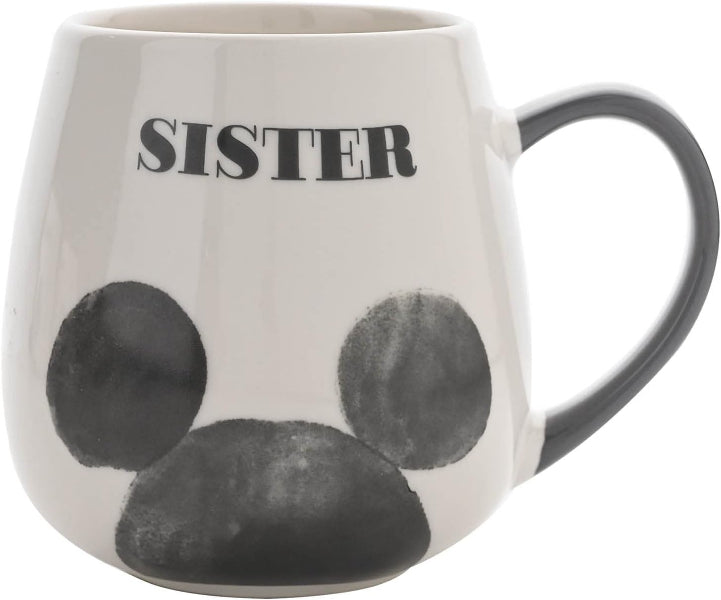 Mug with paw prints and the word 'SISTER' on a white background
