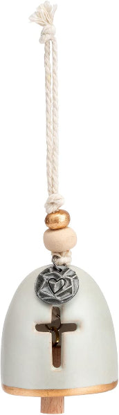 Decorative bell with cross and heart charm on a white background