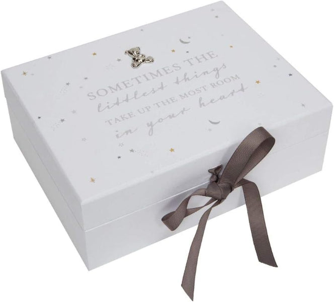White decorative box with text and a brown ribbon on a white background