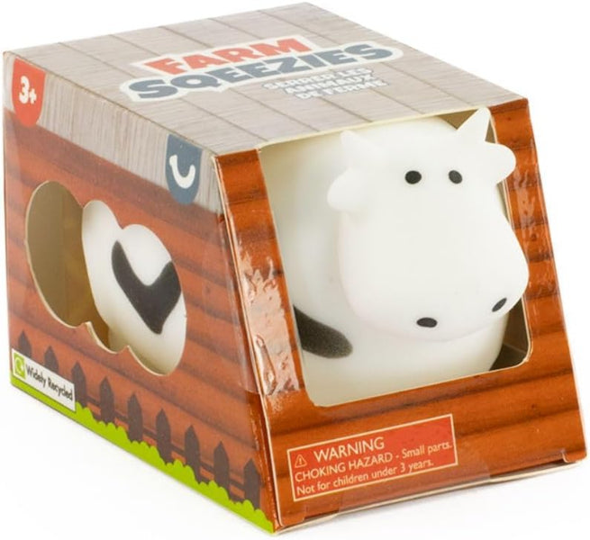 Cow-shaped toy in a 'Farm Soezpies' packaging with wooden design