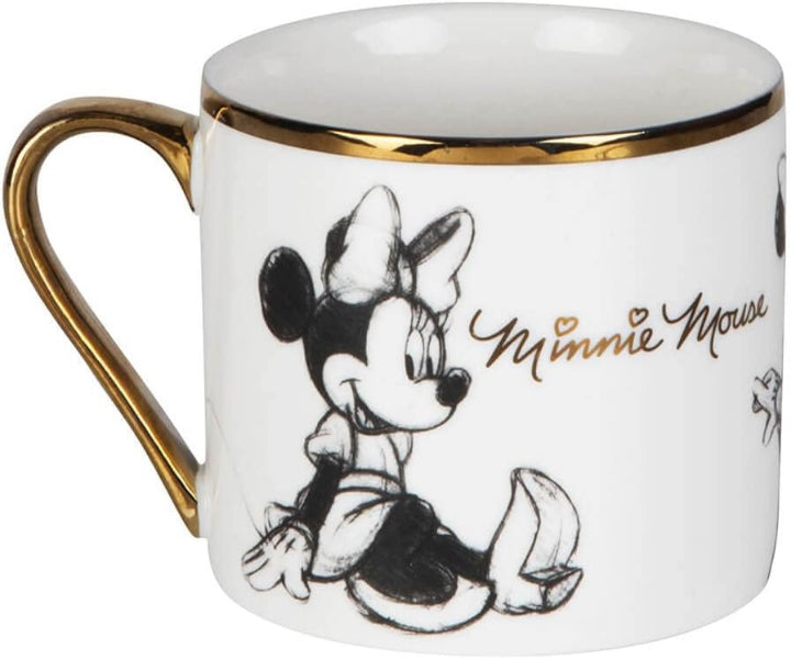 A white ceramic mug featuring a black-and-white sketch of Minnie Mouse, gold trim around the rim and handle, and gold script reading 'Minnie Mouse' on a white background.