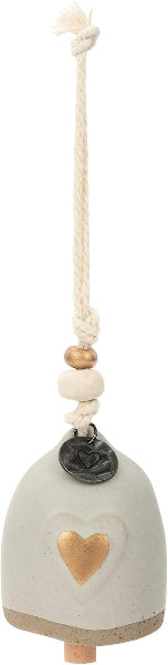A ceramic bird bath ornament with a light gray body, a gold heart detail, a white rope hanger, and wooden beads.