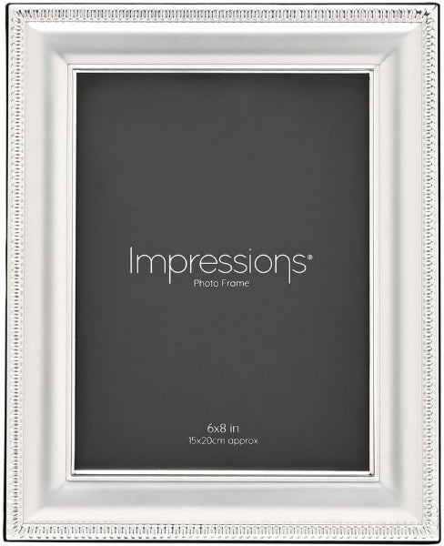 A white decorative picture frame with a beaded border, shown empty with a dark insert card that reads 'Impressions Photo Frame' and '6x8 in'.