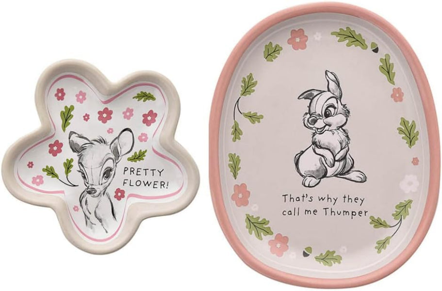 Two ceramic plates with cartoon character illustrations and text on a white background