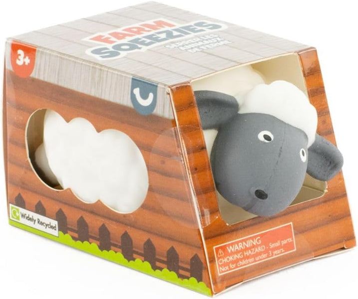 Toy sheep in a packaging box with 'Farm Soezies' branding.