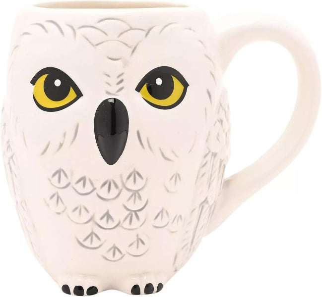 Owl-shaped mug with yellow eyes and black beak on a white background