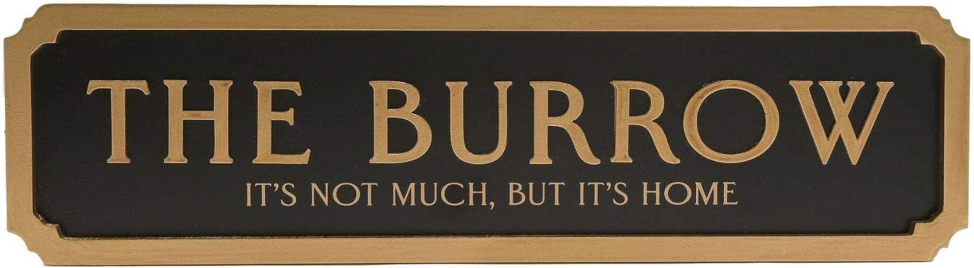 A rectangular black sign with gold lettering that reads “THE BURROW” and smaller text below reading “IT’S NOT MUCH, BUT IT’S HOME,” shown on a plain white background.