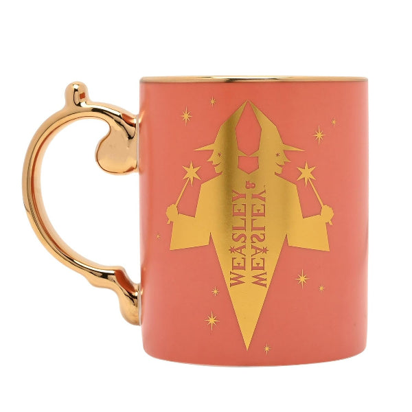 Ceramic mug with gold handle and 'Weasley & Weasley' design on a white background