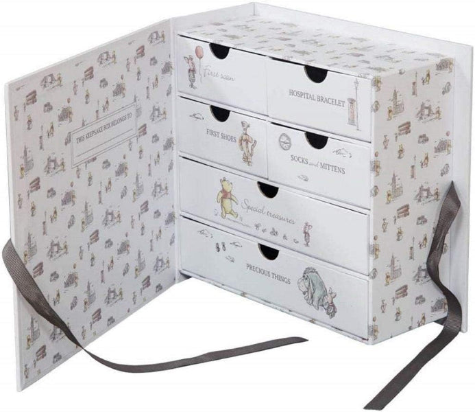 White chest of drawers with illustrated patterns on a white background