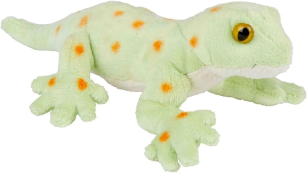 A plush gecko toy in pale green with orange spots and a yellow eye, photographed on a plain white background.