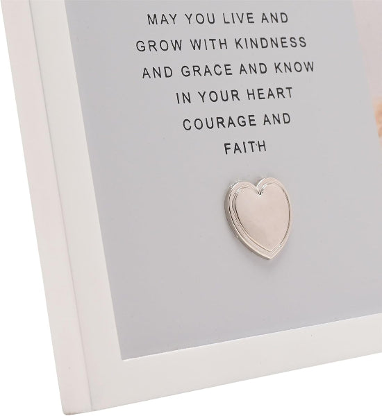 Heart-shaped silver pendant on a card with inspirational text