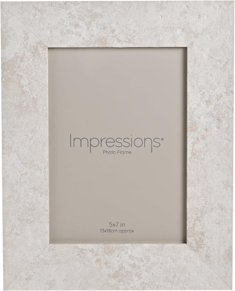 Impressions photo frame on a textured beige background