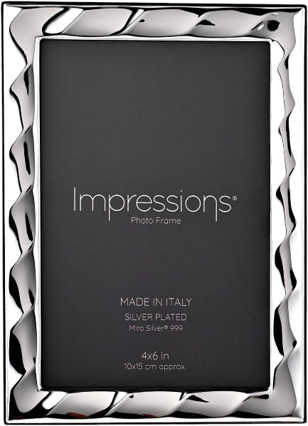 Silver photo frame with 'Impressions' branding on a black background