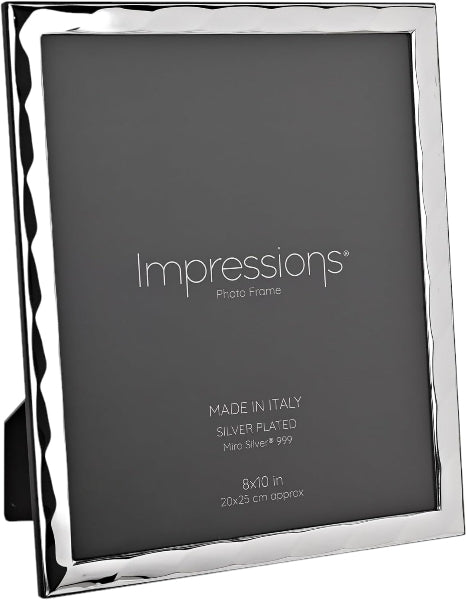 Silver photo frame with 'Impressions' branding and text on a black background