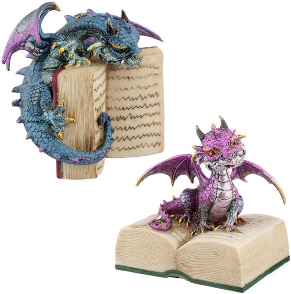 Two dragon figurines on open books, one blue and one purple, on a white background.