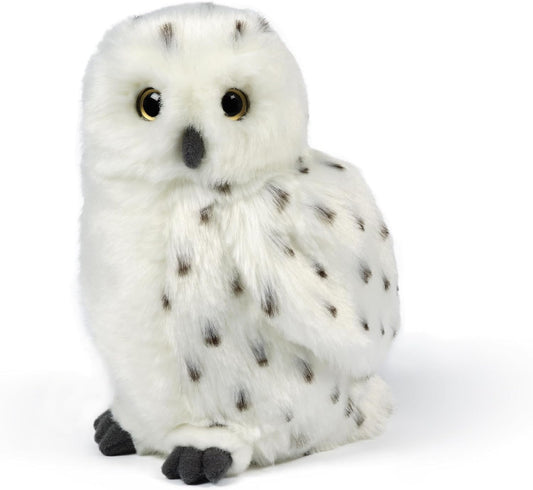 Plush toy owl with white fur and black spots on a white background