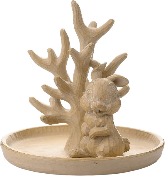 Decorative piece with a deer figure and antlers on a circular base