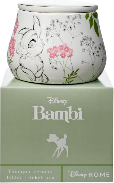 Disney Bambi themed ceramic lidded trinket box with a white body decorated with Bambi sketch and pink flowers, shown on top of its light green branded box.