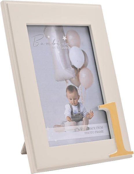 An off-white rectangular photo frame with a gold-colored letter 'L' accent on the right side, shown standing on a small metal base against a white background. The frame contains a sample photo of a baby with balloons.