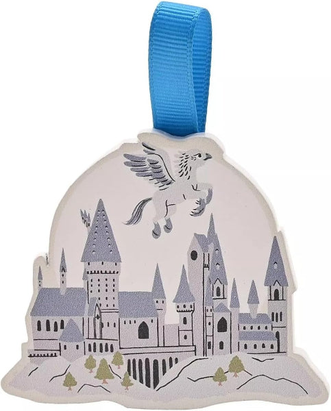 Decorative ornament with a castle design and a blue ribbon on a white background