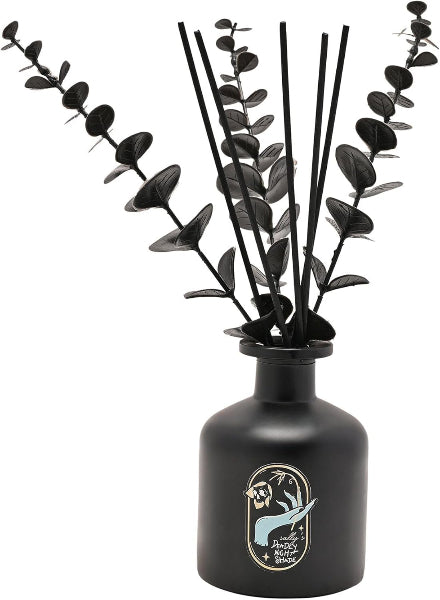 Black vase with eucalyptus branches on a white background