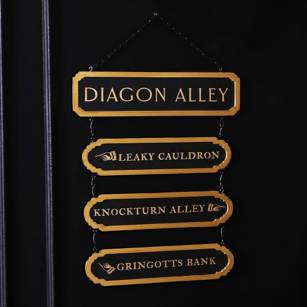 Black notebook with gold 'Diagon Alley' and other wizarding street names on a black background