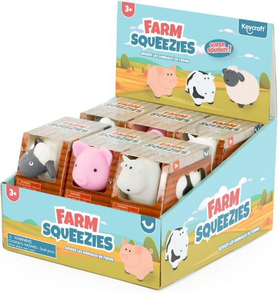 Display box of Farm Squeezies toys featuring farm animals on a white background