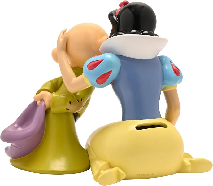 A collectible plastic figurine of Snow White and the Seven Dwarves, showing Snow White from behind kneeling and holding her hand to her head in a gesture of sympathy, with the seven dwarfs beside her. The figurine is set against a plain white background.
