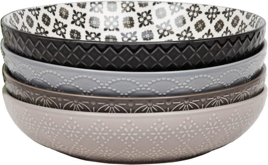 Set of four patterned bowls in gray, black, and white.