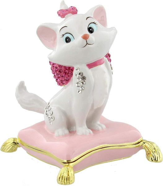 Decorative figurine of a white cat with pink accessories on a pink base with gold feet.